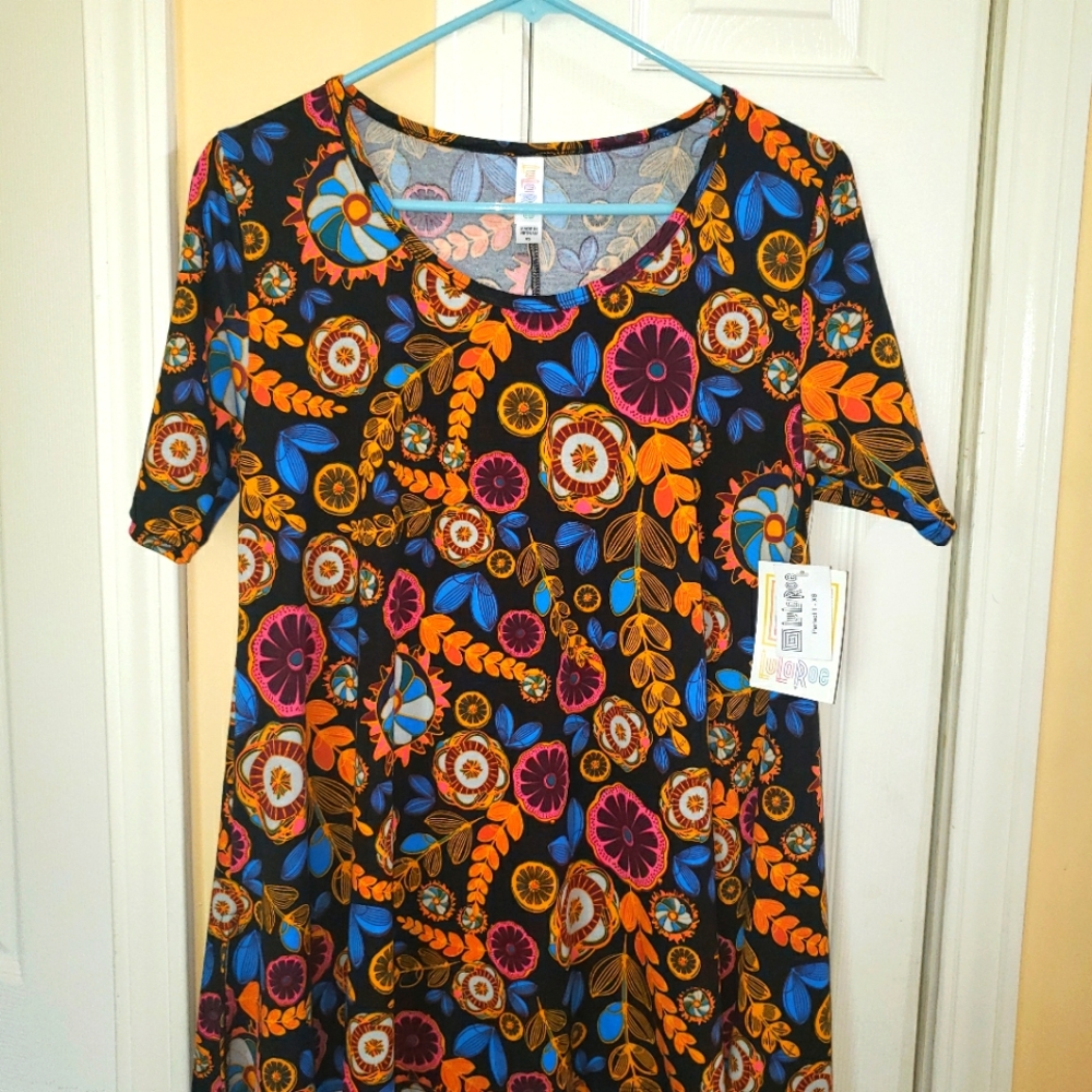 New W/Tags. LU LA ROE Perfect T top can be paired with leggings or bike shorts.